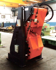 Recoiler with rollers wrapping system