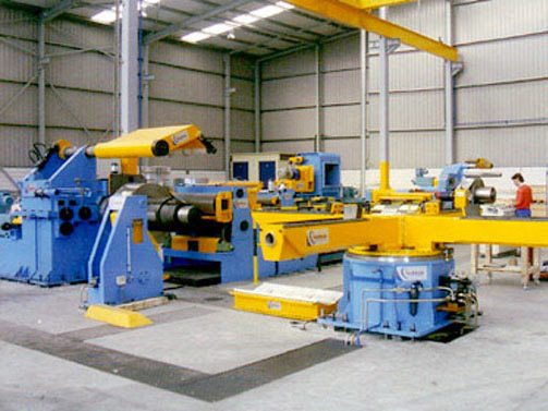 Slit coils exit with four arms capstan